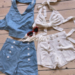 Vintage 1997 inspired Blue and white outfits set with buttons on a wooden surface matching heart shaped sunglasses