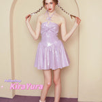 Woman in a purple glitter minin dress standing in front of an archway with 'PeilieeShop KiraYura' branding.
