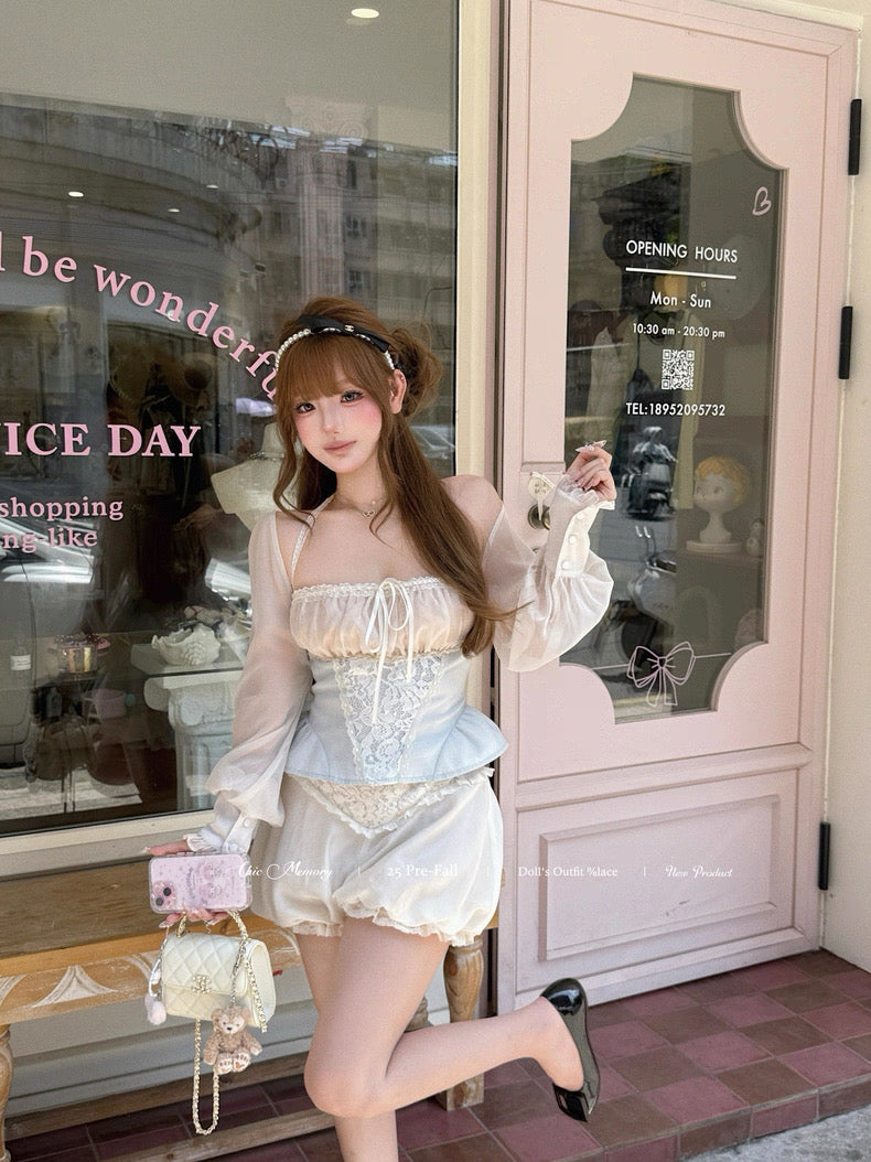 Woman in a stylish outfit standing in front of a store with a pink door.