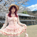 model wearing pastel pink coquette-style mini dress outdoors
