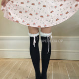 Kitten over the snow over knee socks