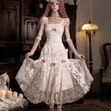 Woman in a detailed vintage white dress with lace and floral patterns in Japanese Gothic Lolita Fashion style.