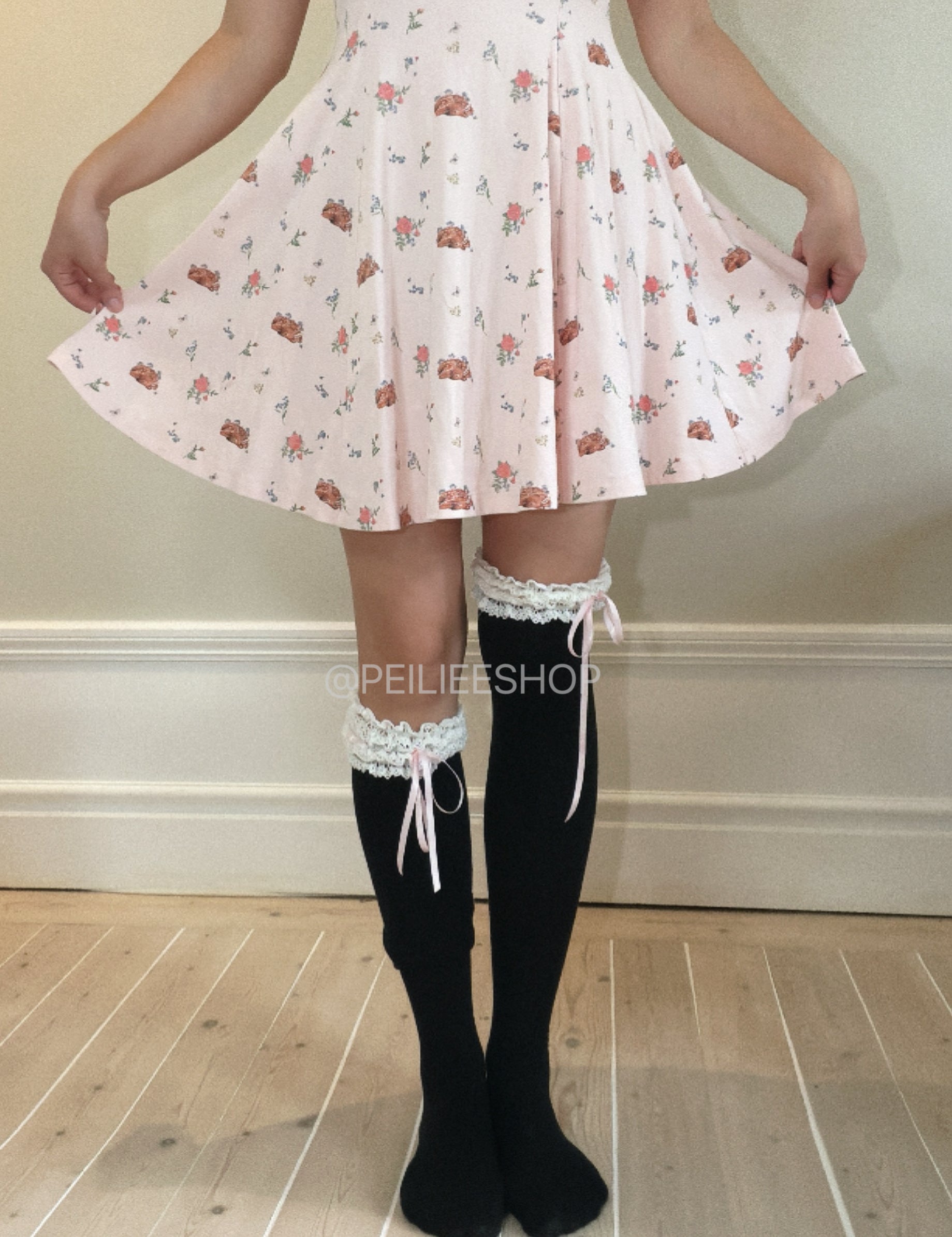 Kitten over the snow over knee socks