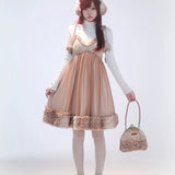 Rose Island Deer collection fawn pattern print faux fur handbag model holding as handbag with matching deer dress