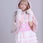 Girl wearing a pink and white fluffy faux fur cape with cat ears and kawaii pastel pink mini  dress