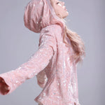 Person wearing a pink sequin hoodie inspired by skins Cassie outfits style 