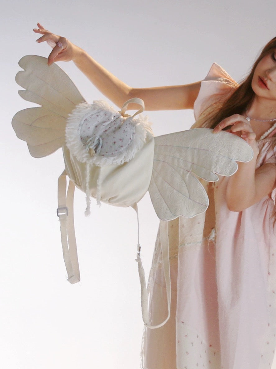 Get trendy with [Rose Island] Angel wings double-shoulder backpack -  available at Peiliee Shop. Grab yours for $43 today!